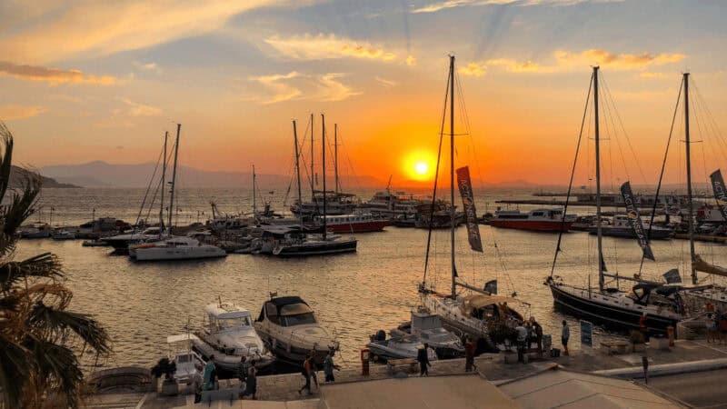 Sailboats on the water in Naxos Harbor at sunset