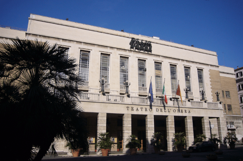 White columned stone facade of Teatro dell’Opera di Roma, the top opera house in Rome Italy.
