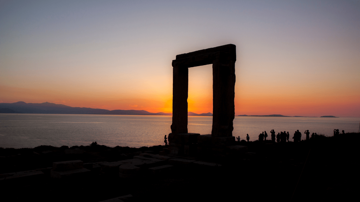 Silhouette of the Portara of Naxos Greece at sunset.