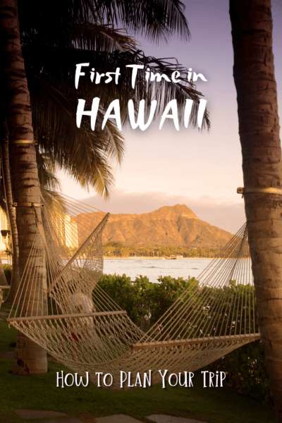 A hammock between palm trees. Volcano in background. Text overlay says "first time in Hawaii - How to plan your trip"
