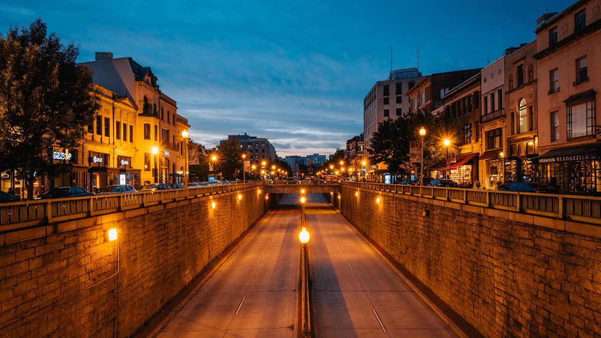 Buildings lining a street at Dupont Circle at twilight