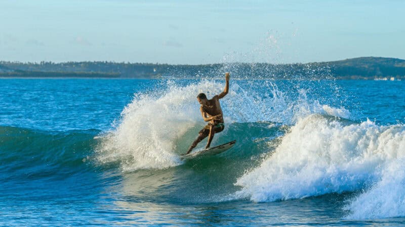 Surfer tackling a wave