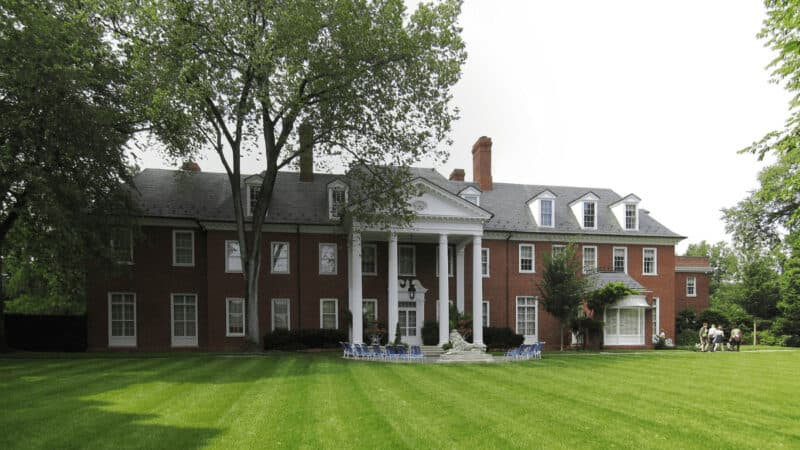 The back side of Hillwood Estate in Washington DC. Tree in the foreground