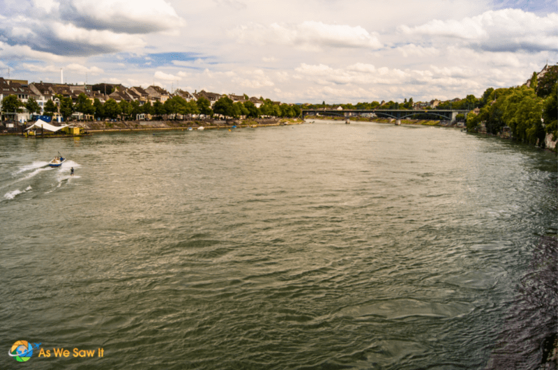 Boat on the Rhine river in Basel Switzerland, towing a waterskiier