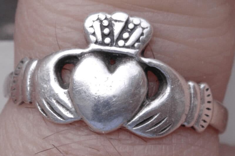 An Irishh Claddagh ring on a finger