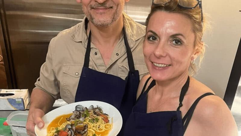 Woman holding a dish she created at a cooking class in France
