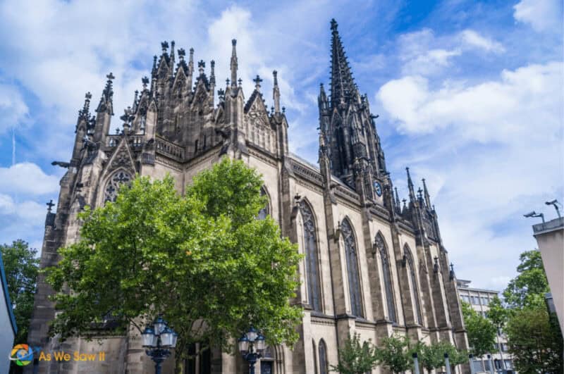 Elisabethenkirche, also known as Elizabeth Church, with a tree in front of it.