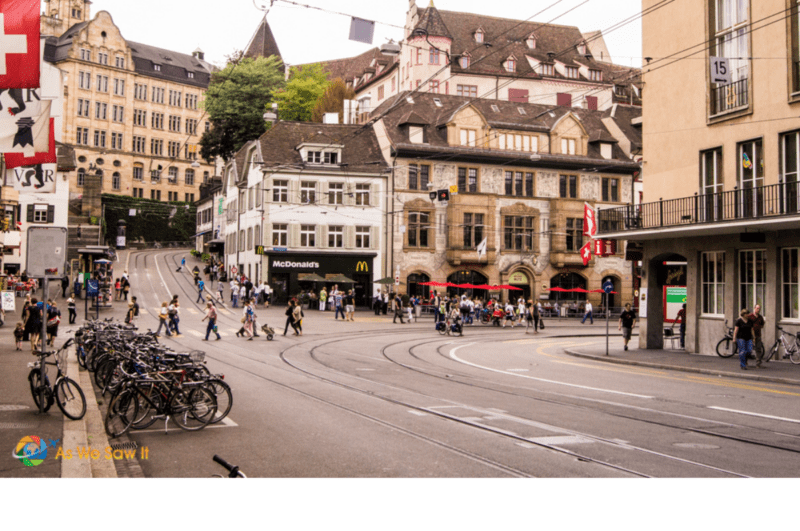 Old town in Basel has historic houses and a tram line running through the street