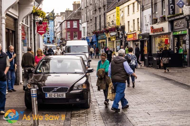People walking on a cobbled street in Galway Ireland