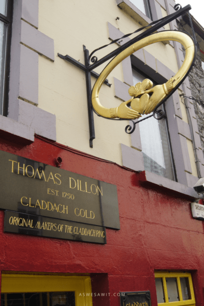 Sign in the shape of a Claddagh Ring sticking out from the original store, Thomas Dillon Galway Ireland