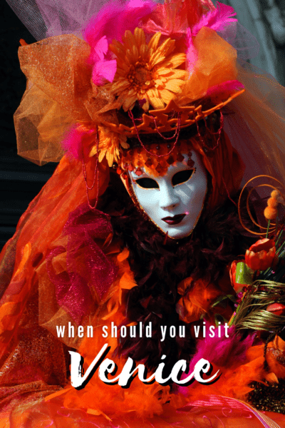 A person dressed for Venice Carnival. The text overlay says "when should you visit Venice"