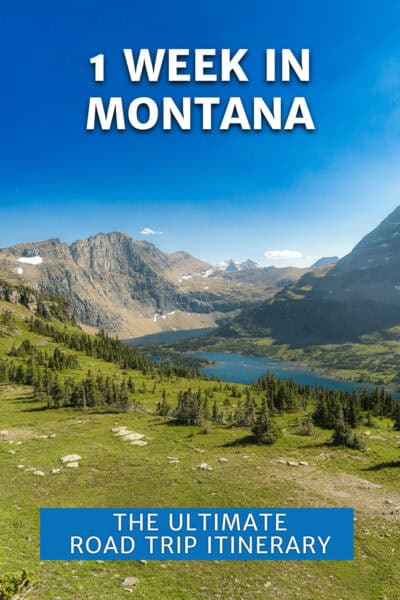 Snow-capped mountains behind a lake. Field and trees in foreground. The text overlay says "1 week in montana the ultimate road trip itinerary"
