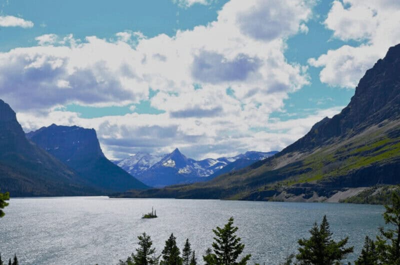 Wild Goose Island on lake in western Montana. Clouds and mountains in background