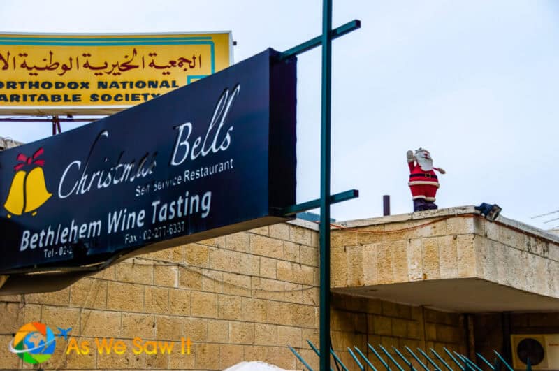 santa claus statue and english language signs in Bethlehem, Palestine