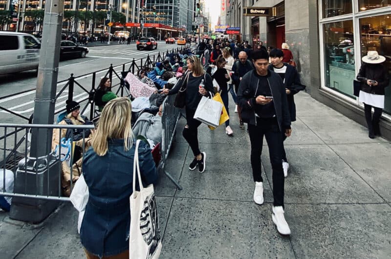 people walking on a sidewalk