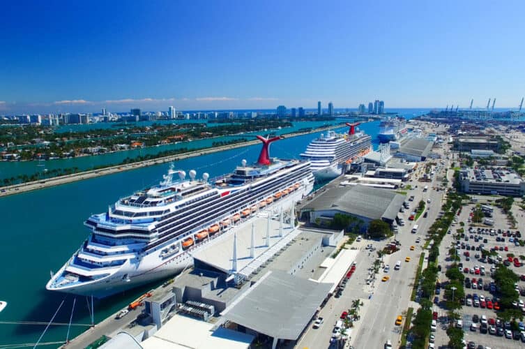 Cruise ships docked at PortMiami with the Miami skyline in the background
