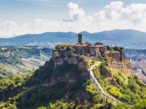 Civita di Bagnoregio perched on a rocky hill, reached by a pedestrian bridge