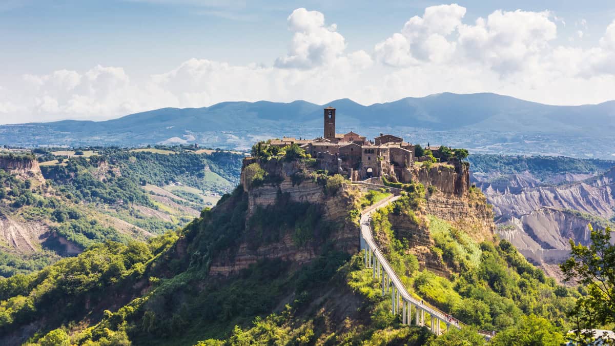 Civita di Bagnoregio perched on a rocky hill, reached by a pedestrian bridge
