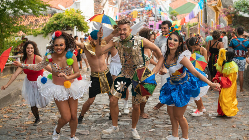 Carnival street celebration with dancers and colorful costumes in Rio de Janeiro