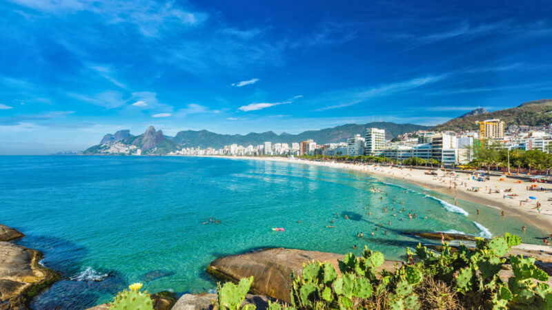 Ipanema Beach in Rio de Janeiro with the Dois Irmãos mountains in the background