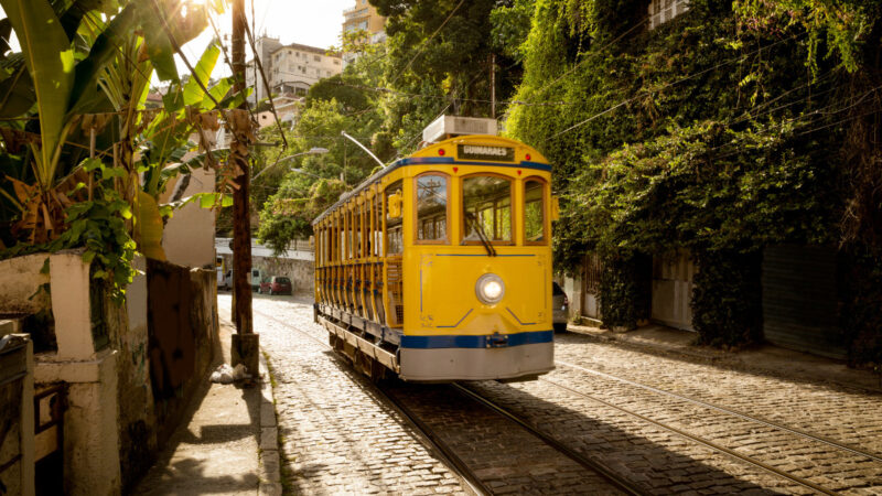 Historic yellow tram traveling through the Santa Teresa neighborhood in Rio de Janeiro