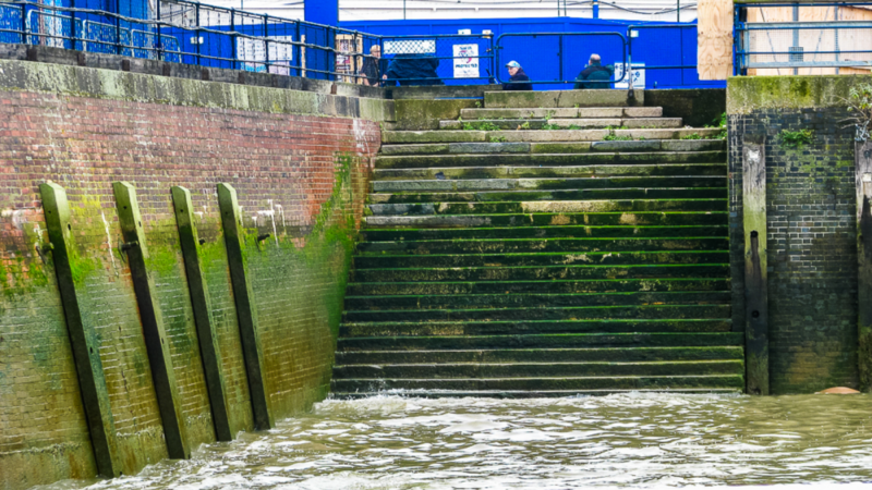 River stairs and embankment at low tide along the Thames in Docklands London