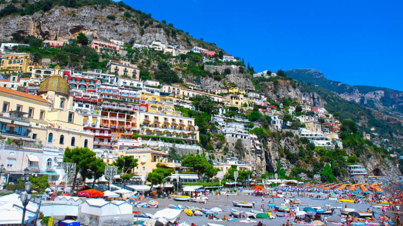 Crowded beachfront and vertical hillside hotels in Positano on the Amalfi Coast