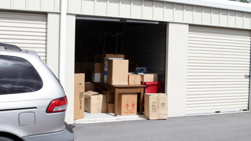 Drive-up storage unit with boxes and vehicle access