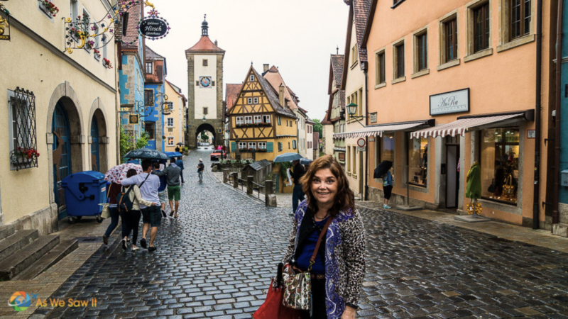 Linda sightseeing on a rainy day in Rothenburg, Germany, with a crossbody bag