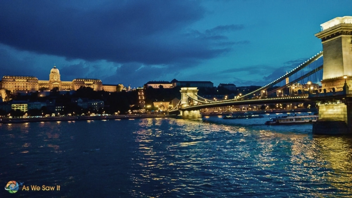 Chain Bridge and Buda Castle illuminated at night along the Danube in Budapest