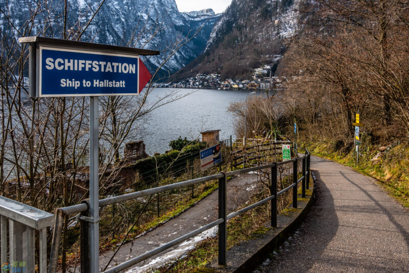 Sign pointing from Hallstatt train station to the ferry across the lake