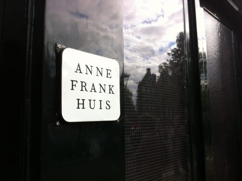 closeup of sign on the front of the Anne Frank building. It says Anne Frank Huis