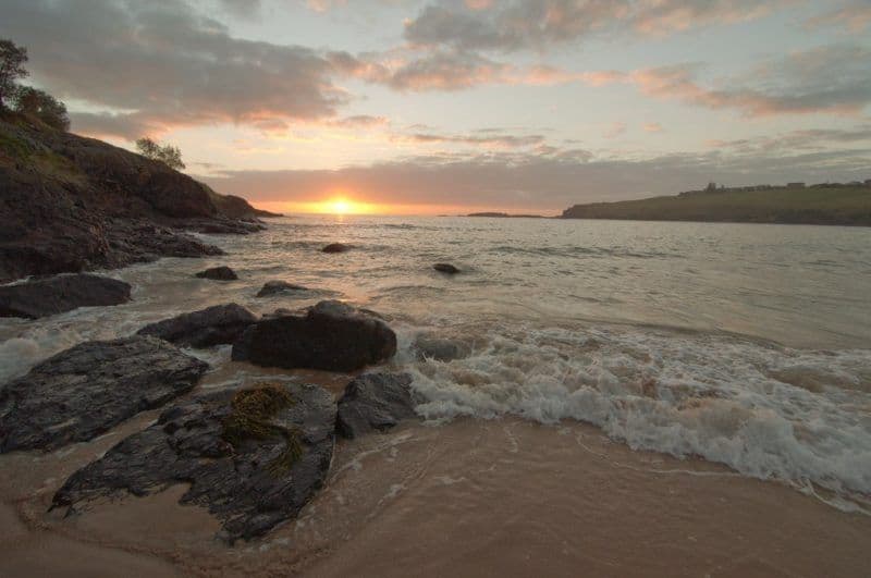 Sun setting over the water at Kiarna Beach. 