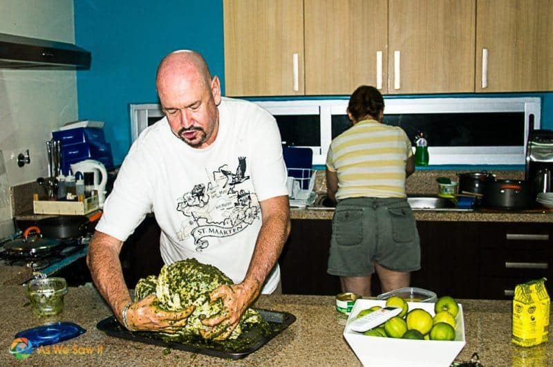 Man preparing turkey in a kitchen