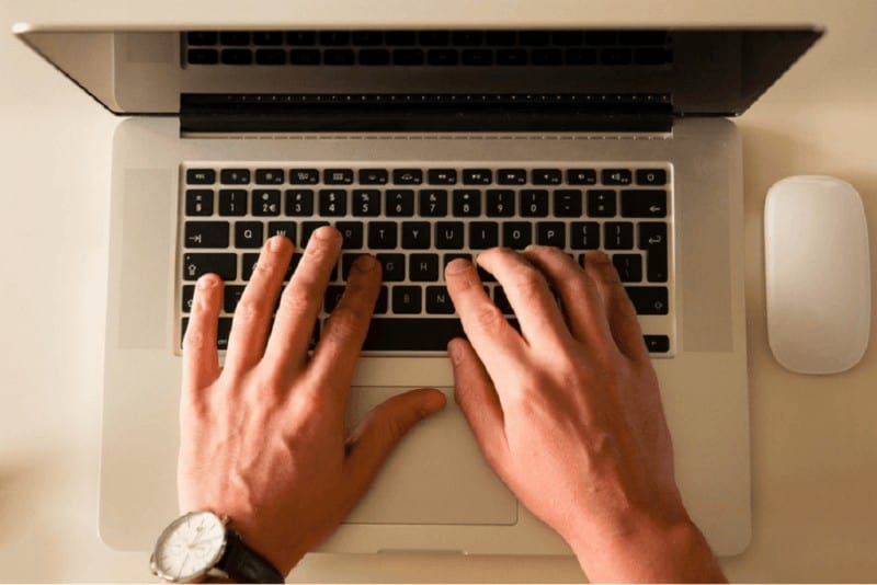 Hands on a laptop keyboard to illustrate Write for us