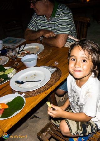 Our little guy smiles and shows off his empty plate