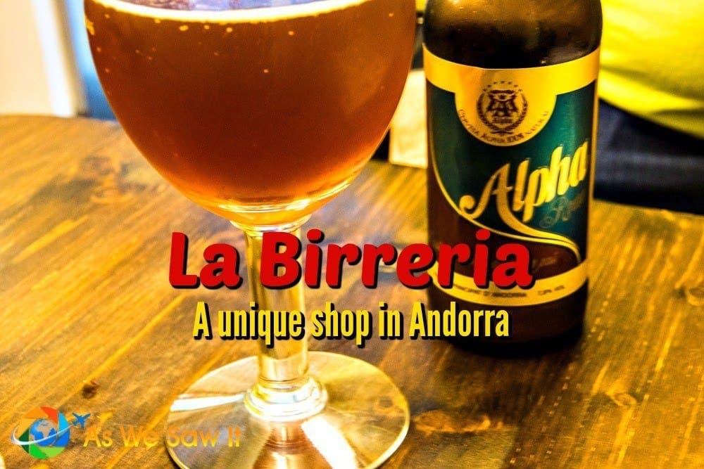Glass of amber beer with a bottle of Alpha next to it. Text overlay says La Birreria - a unique shop in Andorra.