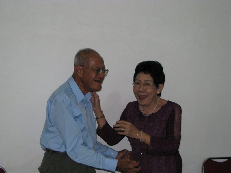 Mama and Papa, laughing after an unusually public kiss.