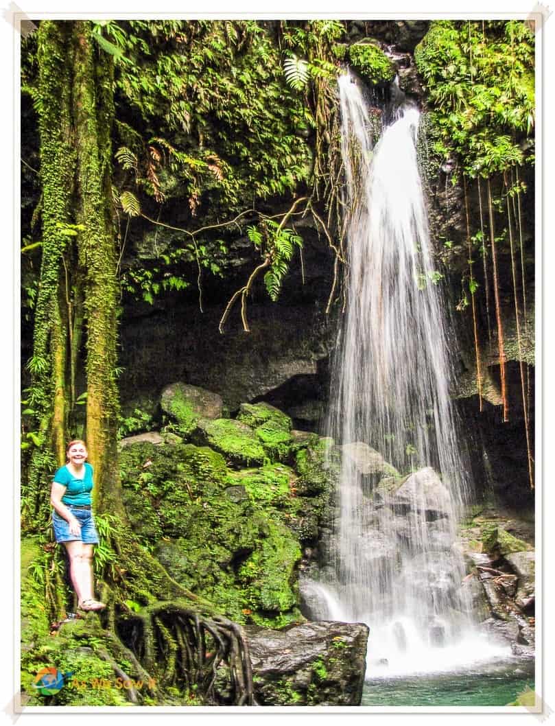 Linda stands beside the waterfall at Emerald Pool Dominica