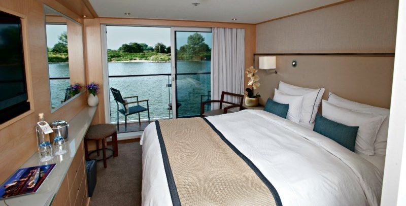 Viking River Cruises veranda stateroom. River shore in background