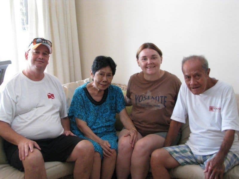 Dan and Linda posing for a photo with Mama and Papa