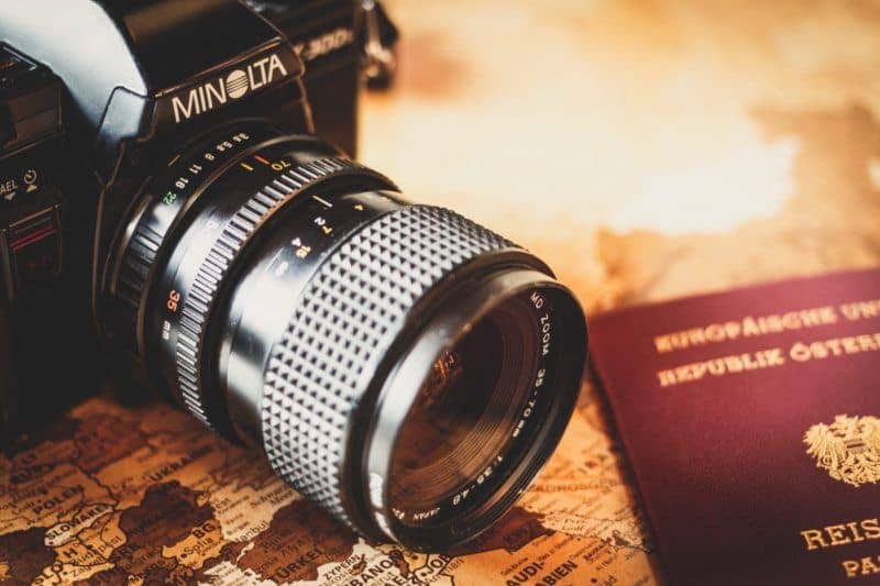 passport and camera for travel article