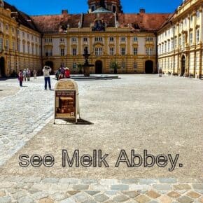 front of Melk Abbey. Text overlay says see melk abbey